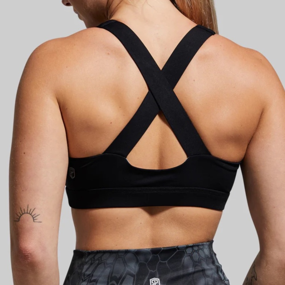 Women’s Born Primitive ESSENTIAL sports bra. Size medium. Plain black.